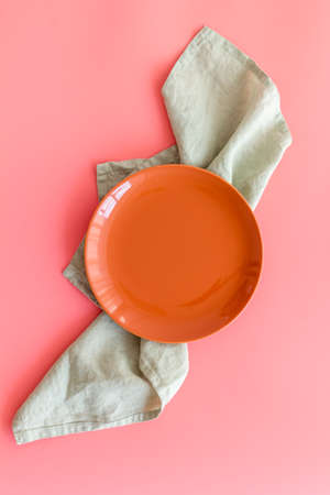 Table setting top view. Empty plate on napkin - dishware for dinnerの写真素材
