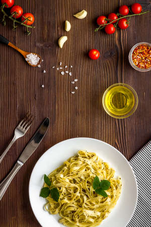 Italian pasta fettuccine with cream sauce and herbsの写真素材