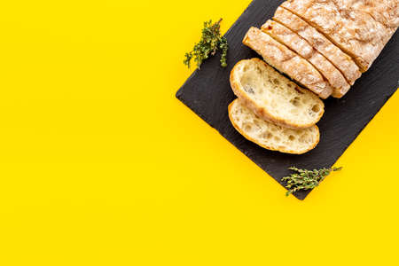 Sliced bread ciabatta with rosemary. Breakfast background