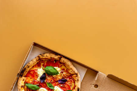Margherita italian pizza with tomatoes cheese and basil, top viewの写真素材