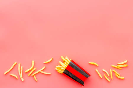 Potatoes french fries in paper box, top viewの写真素材
