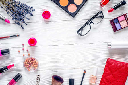 trendy woman desk with cosmetic, lavender, glasses white background top view mockupの写真素材