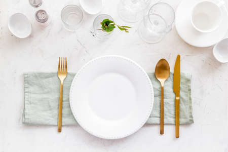 Eating utensil set - table setting for dinner with plate on napkinの写真素材