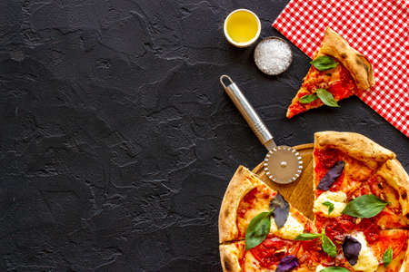 Homemade italian pizza margherita with tomatoes cheese and basil, top viewの写真素材