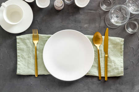 Eating utensil set - table setting for dinner with plate on napkinの写真素材