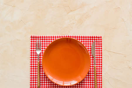 Dinner plate setting with cutlery and napkin. Top viewの写真素材