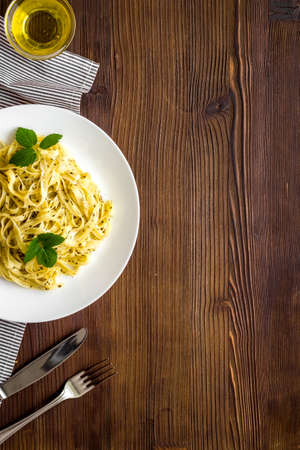 Plate of italian pasta fettuccine with cream sauce and herbsの写真素材