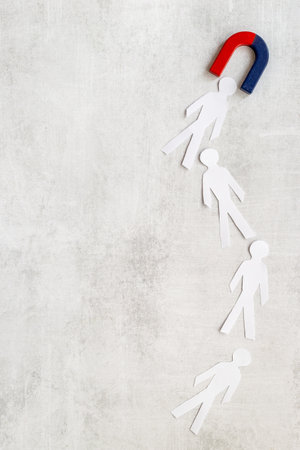 Corporate menegement team concept with horseshoe magnet and human figuresの写真素材