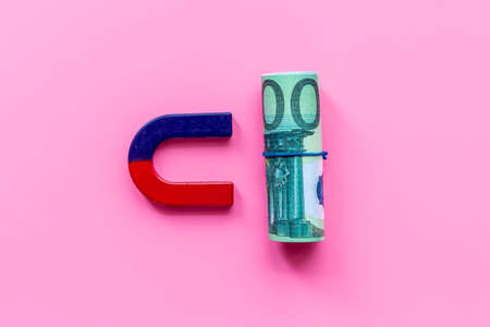 Business success concept. Magnet attracting money