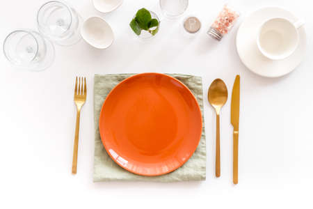 Crockery set - table setting for dinner with dishes and glasses