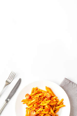 Plate of pasta with tomato sauce and herbsの写真素材