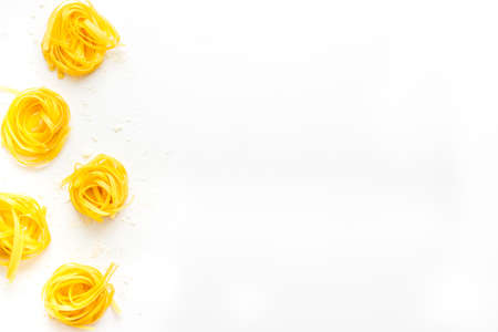 Fettuccine pasta pattern with flour, top viewの写真素材