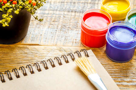 hobby painting - workplace with colored pencils, gouache jarsの写真素材