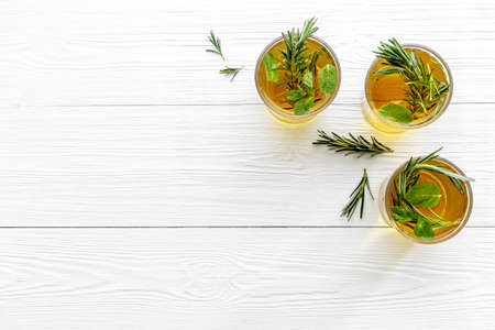 Summer cold tea and fresh herbs rosemary in glassesの写真素材