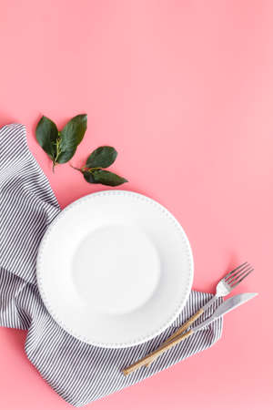 Empty dish and cutlery on napkin. Table setting top viewの写真素材