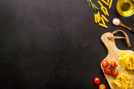 Pasta ingredients with tomatoes olive oil spices and herbs