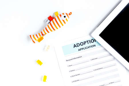 baby adopting concept with application and tablet top view mock upの写真素材