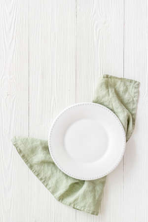 Table setting top view. Empty plate on napkin - dishware for dinnerの写真素材