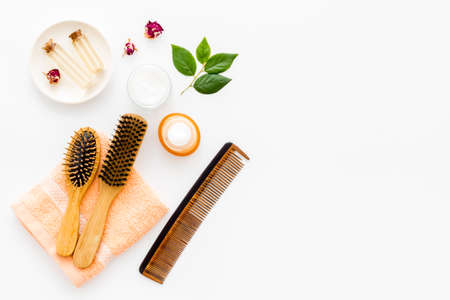 Hair care products with brush flat lay, top view