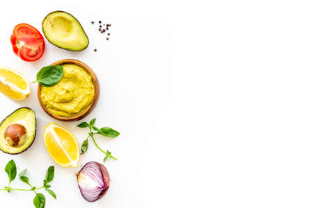 Spicy guacamole avocado dip with herbs and tomatoes
