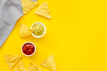Mexican food nachos chips with salsa and guacamole saucesの写真素材