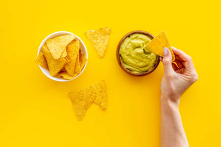 Corn nachos chips with avocado guacamole top viewの写真素材