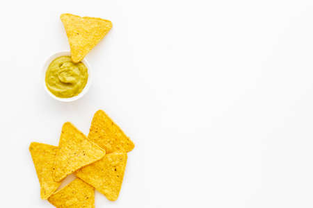 Corn nachos chips with avocado guacamole top viewの写真素材