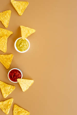 Mexican food nachos chips with salsa and guacamole saucesの写真素材