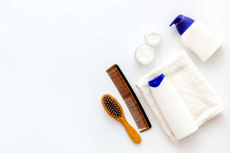 Hair care products with brush flat lay, top viewの写真素材