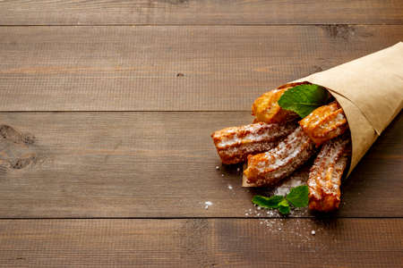 Churros street food dessert in paper bagの写真素材