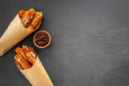 Fast food sweets - churros in paper bagの写真素材