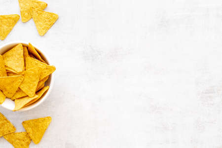 Tortilla nachos chips in bowl. Mexican food backgroundの写真素材