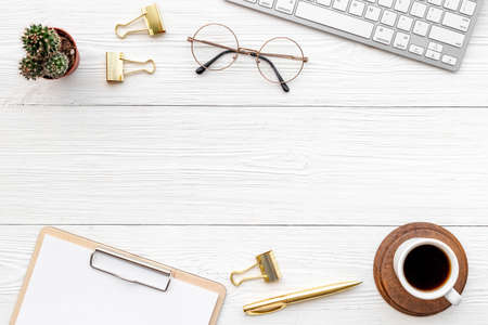 Top view of office working place with computer and cup of coffeeの写真素材