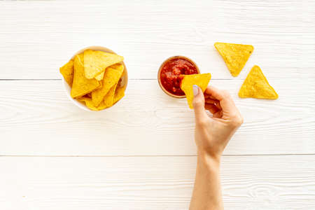 Mexican food nachos chips with tomato salsa sauce, top viewの写真素材