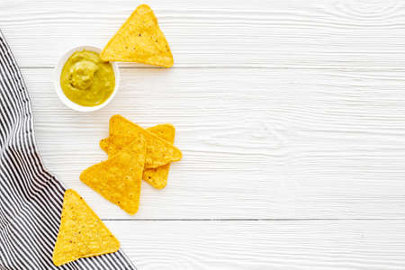 Corn nachos chips with avocado guacamole top viewの写真素材