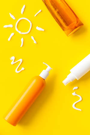 Suntanning lotion with cream in shape of sun, top viewの写真素材
