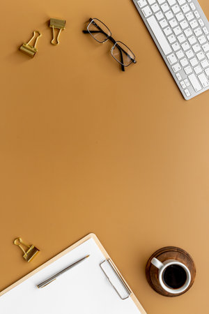 Student desk top view with computer and clipboardの写真素材