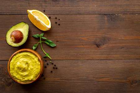 Green guacamole avocado dip in bowl, top viewの写真素材