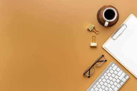 Top view of office working place with computer and cup of coffee