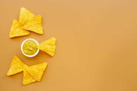 Corn nachos chips with avocado guacamole top viewの写真素材