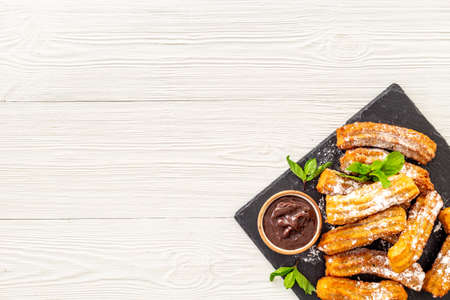 Spanish churros waffles with chocolate and sugar