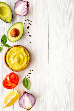 Spicy guacamole avocado dip with herbs and tomatoesの写真素材