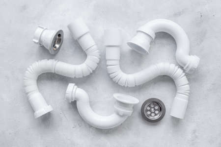 Plumbing work equipment with pipes and fittings, top view