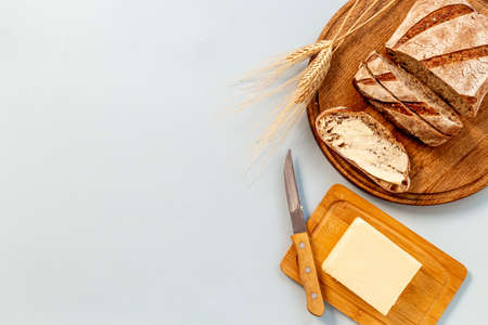 Home baked bread with butter. Healthy breakfast, top view