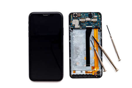 Repairing electronics circuit board - mobile phone with microchipsの写真素材