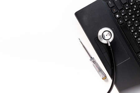 Computer with stethoscope. Tech support or repaire pc system conceptの写真素材