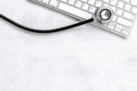 Computer with stethoscope. Tech support or repaire pc system conceptの写真素材