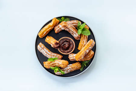Spanish churros waffles with chocolate and sugar