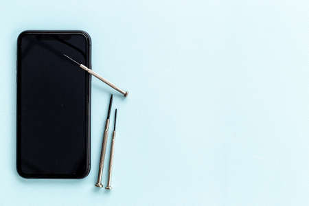 Repairing electronics - mobile phone with tools