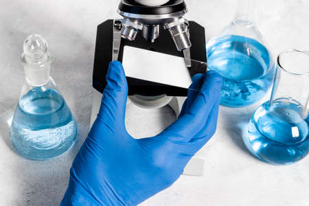 Research in medical laboratory with microscope equipment, close up